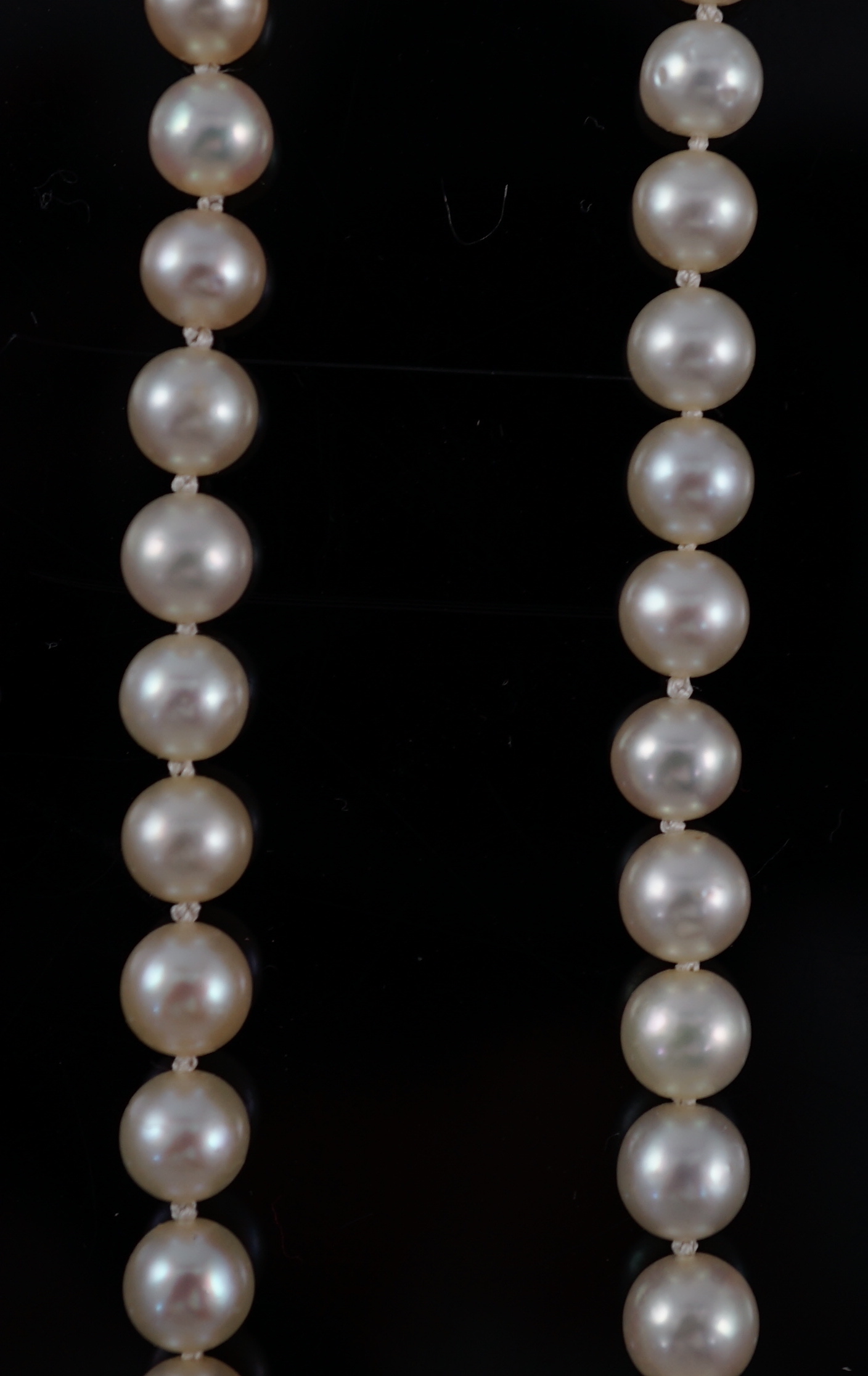 A late Victorian single strand graduated natural saltwater pearl necklace, with six stone old round cut diamond set silver and gold rectangular clasp